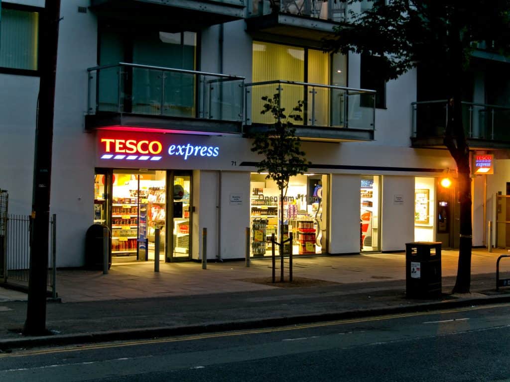 A Tesco Express at night in London