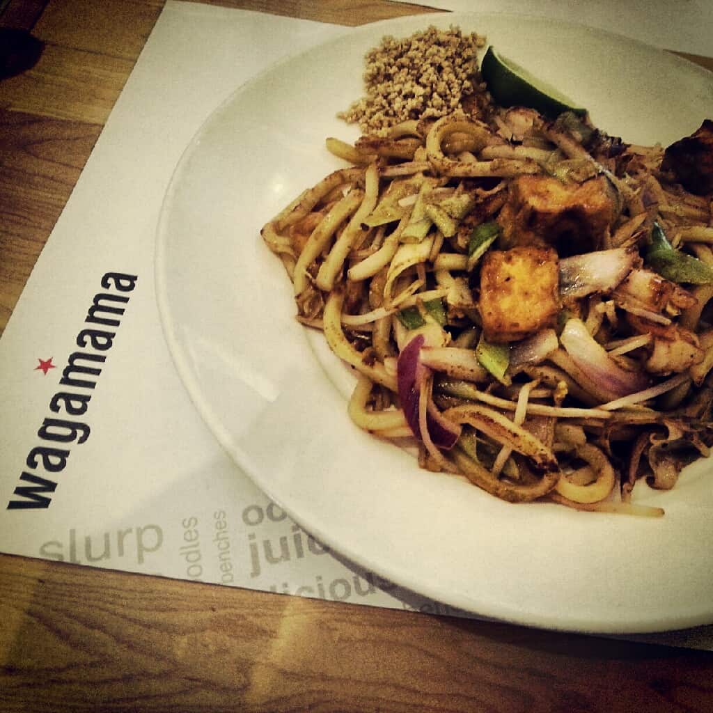 A plate of food sitting on top of a Wagamama menu