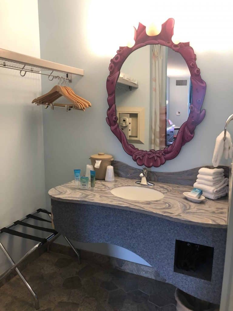 Sink and sea coral styled mirror inside the Art of Animation Little Mermaid room