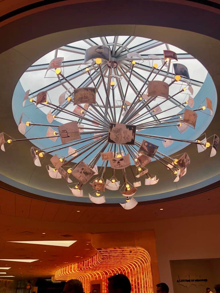 Art of Animation review ceiling light with drawn animation slides as a chandelier