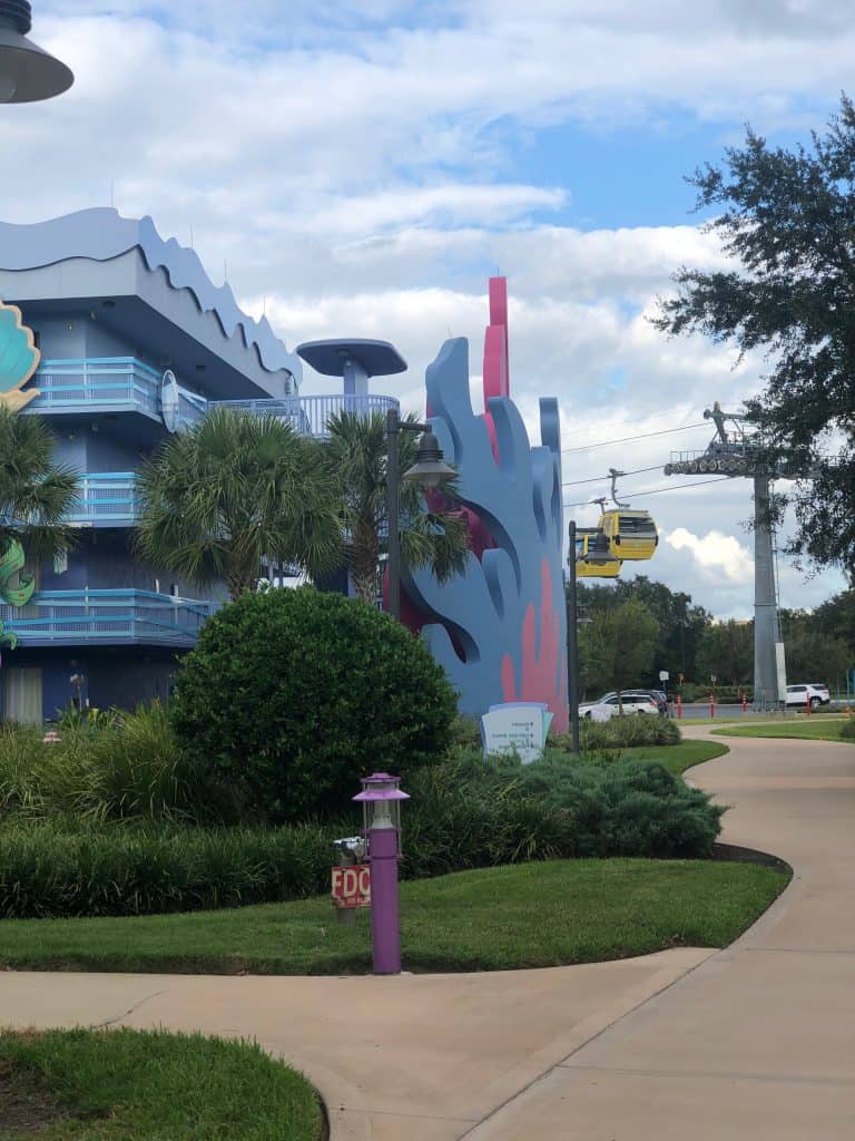 Theming at Disney's Art of Animation Resort with two Skyliner cars in the background