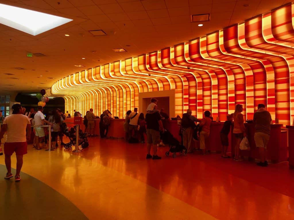 Inside the Disney Art of Animation lobby, with red lights