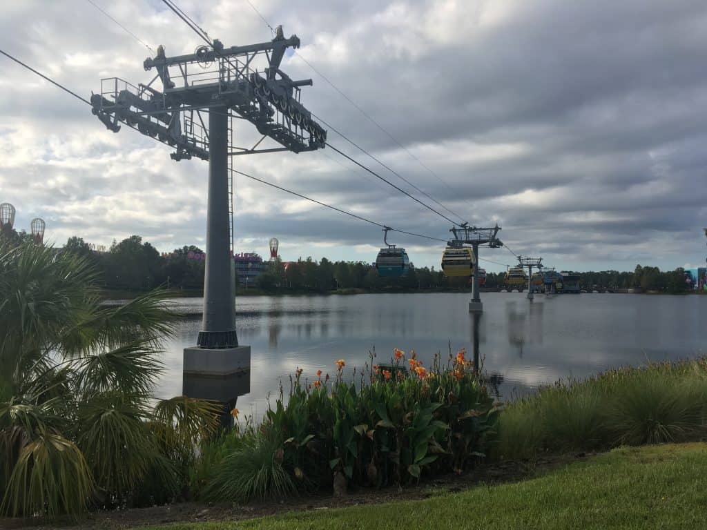 The view outside the Skyliner at the Art of Animation resort, with cars going over the lake