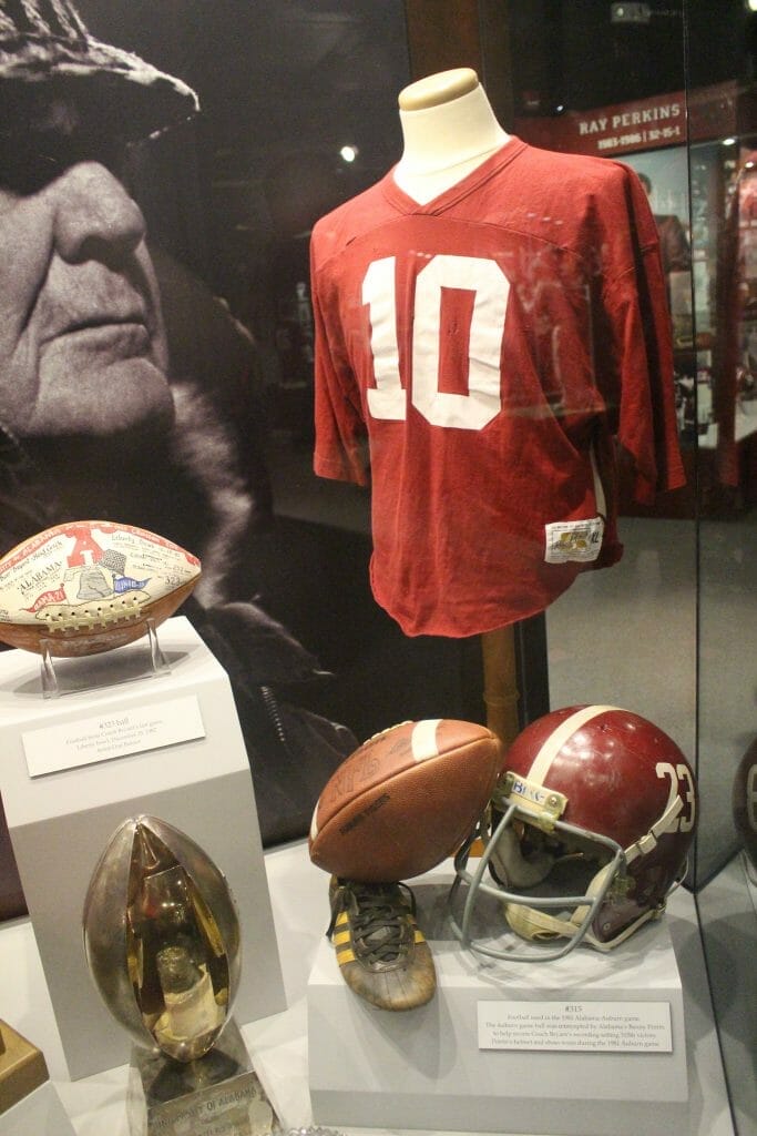 Football items in a display cabinet at the Bear Bryant museum in Tuscaloosa
