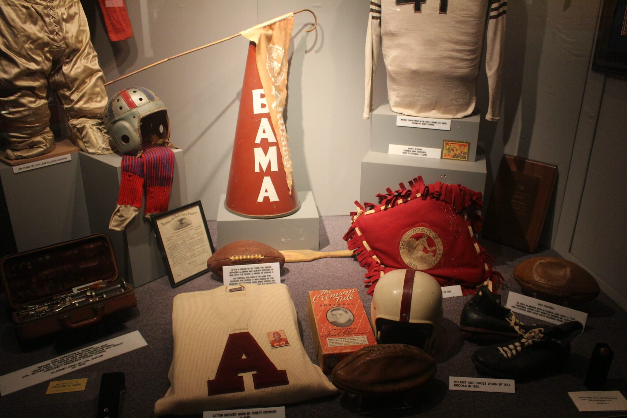 Football items in a display cabinet at the Bear Bryant museum in Tuscaloosa