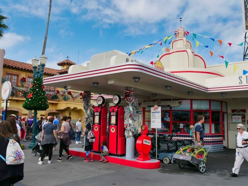 A gas station decorated for Christmas at Hollywood Studios at Christmas