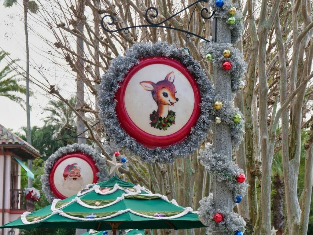A decorative Christmas sign with Bambi in it covered in silver tinsel