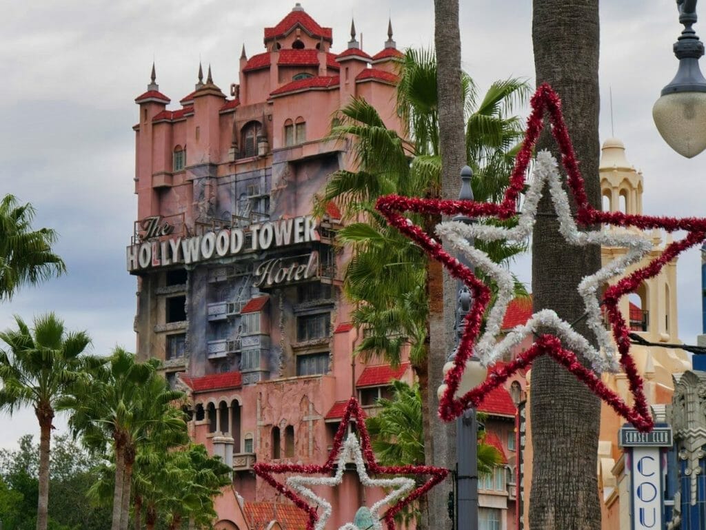 Hollywood Tower Hotel with Christmas decorations in front, including a large red and white star