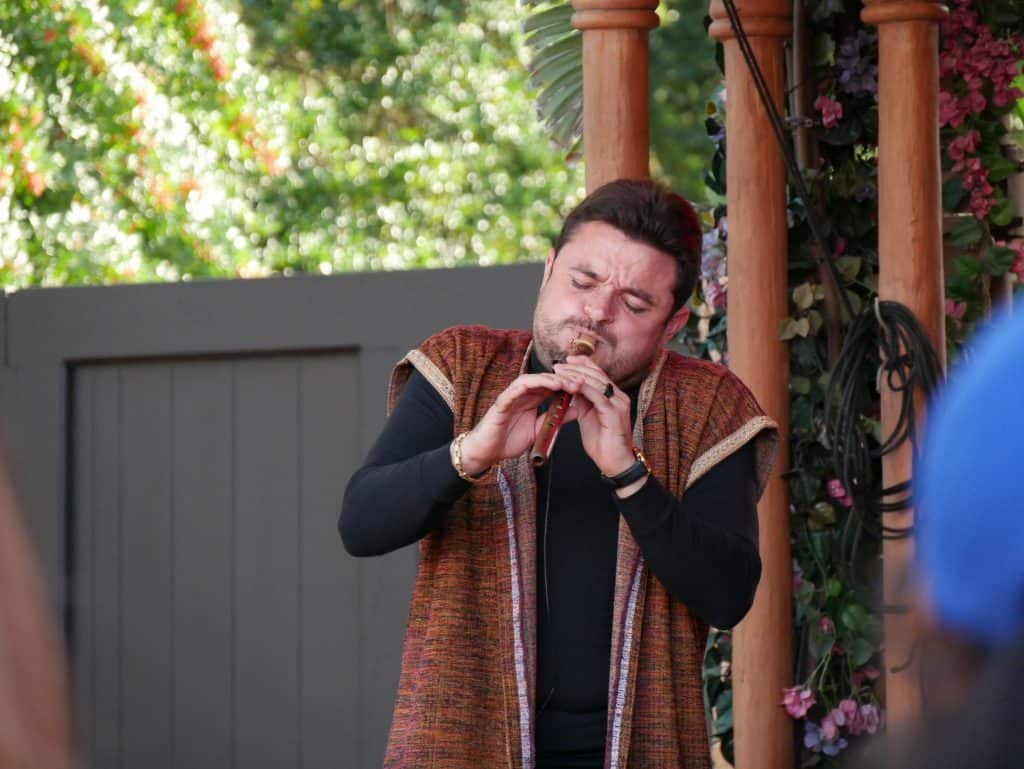 Man playing Moroccan instrument at Epcot, Disney World at Christmas