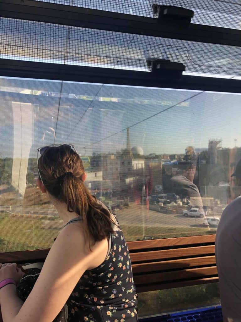 Kalyn looking out of a Disney Skyliner car
