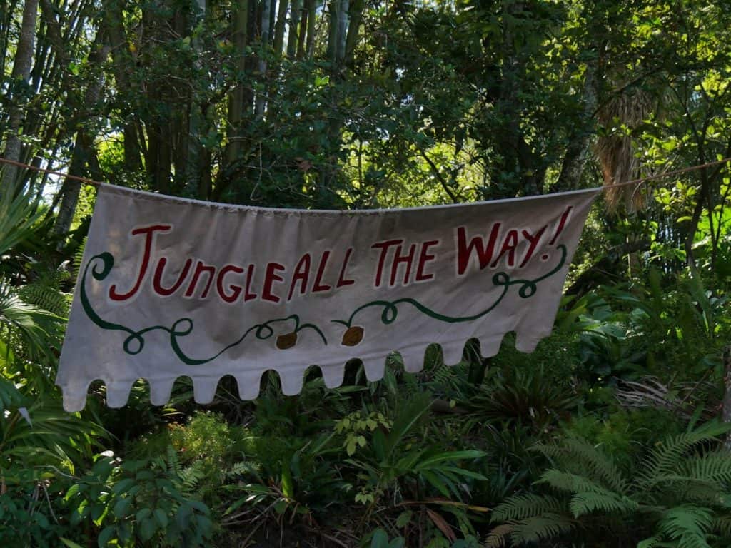 A sign saying "Jungle All The Way" on the Jungle Cruise at the Magic Kingdom in Disney World at Christmas
