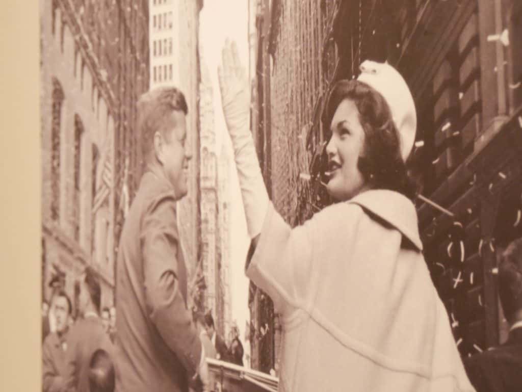 Photo of John F Kennedy and Jacqueline Kennedy with her waving