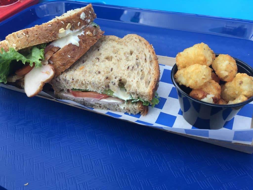 A turkey sandwich from Woody's Lunchbox with tater tots