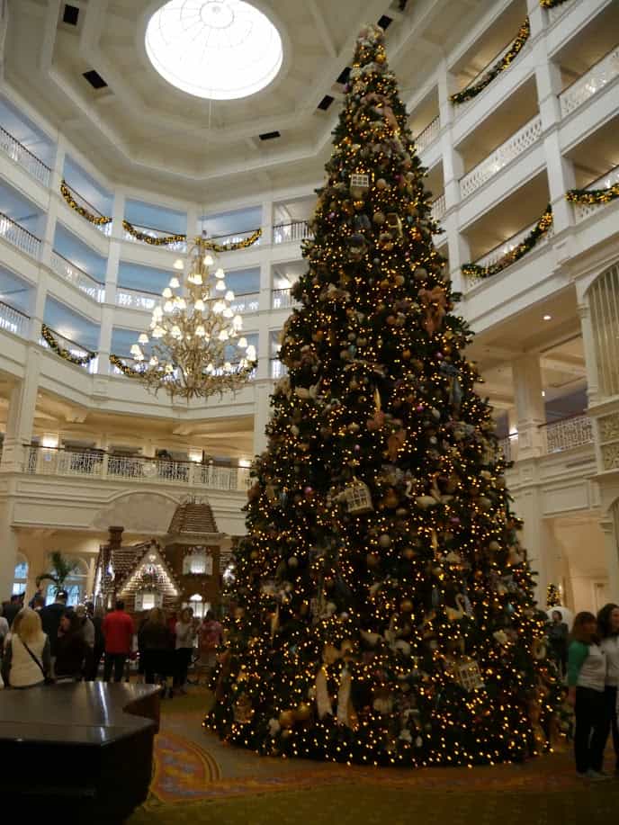 A large Christmas tree in the middle of the hotel at the Grand Floridian Disney World resort at Christmas