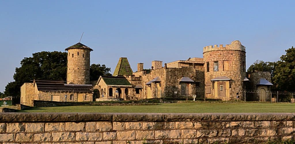 A dilapidated castle with a sunset glow on it, in Texas