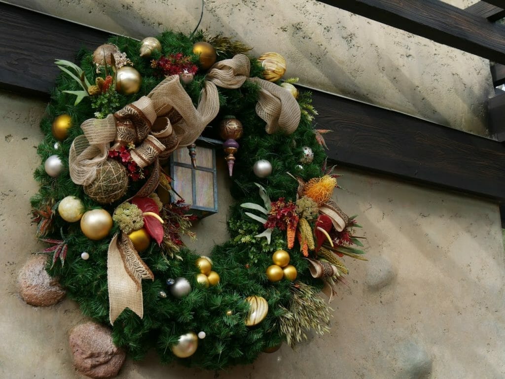 A Christmas wreath on a wall at Animal Kingdom