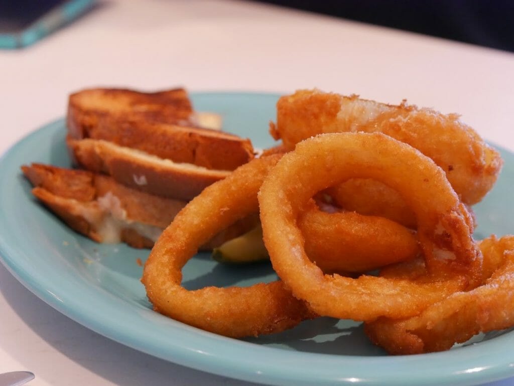 Onion rings on a blue plate