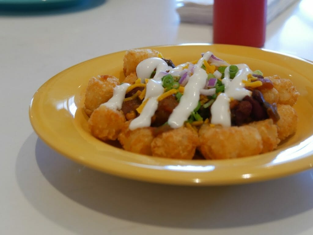 Tater tots on a yellow plate