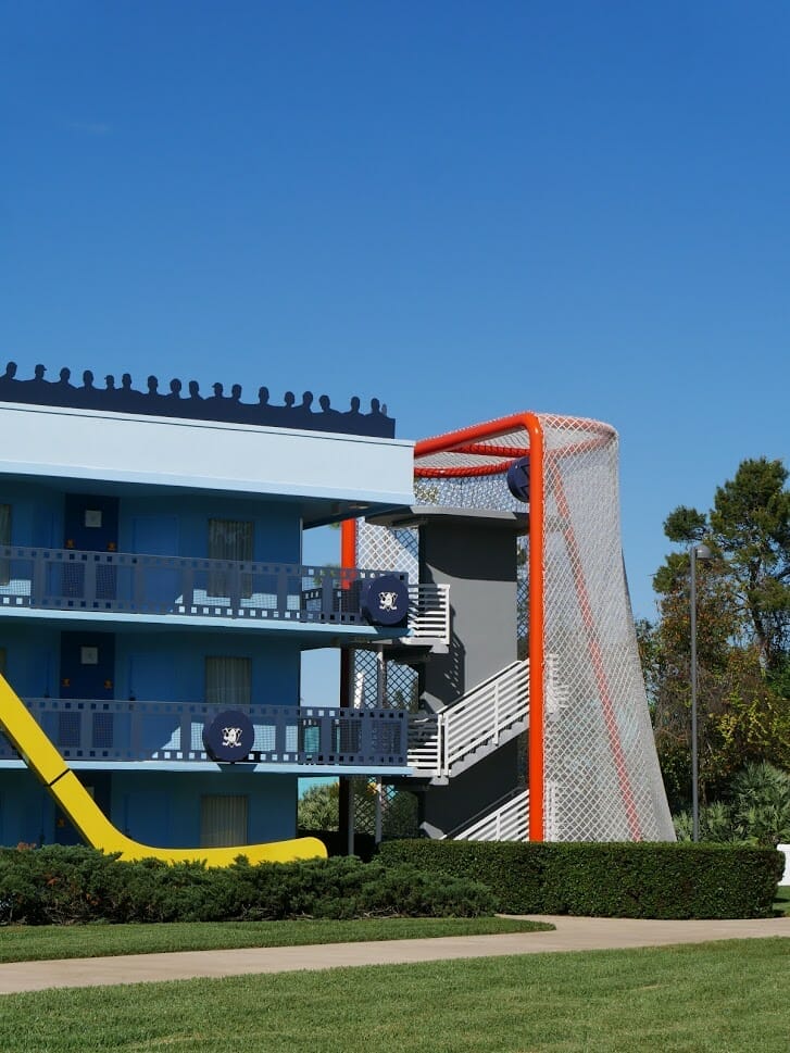 An ice hockey goal covering the stairs up a hotel building at Disney All-Star Movies