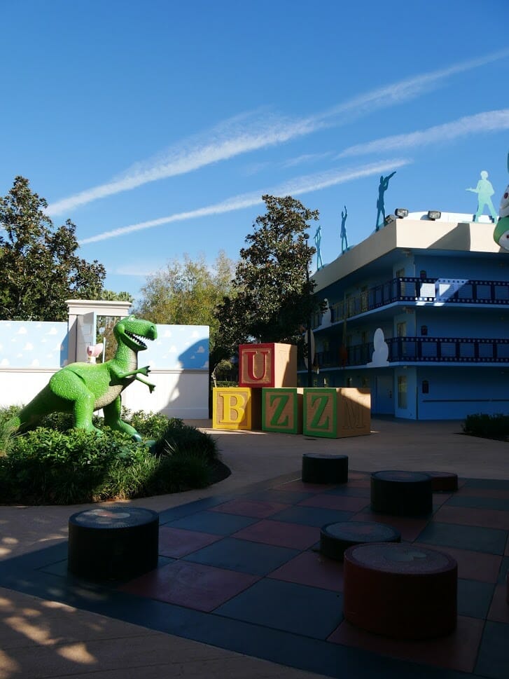 Disney All Star Movies resort Toy Story area with Rex and some play items in front