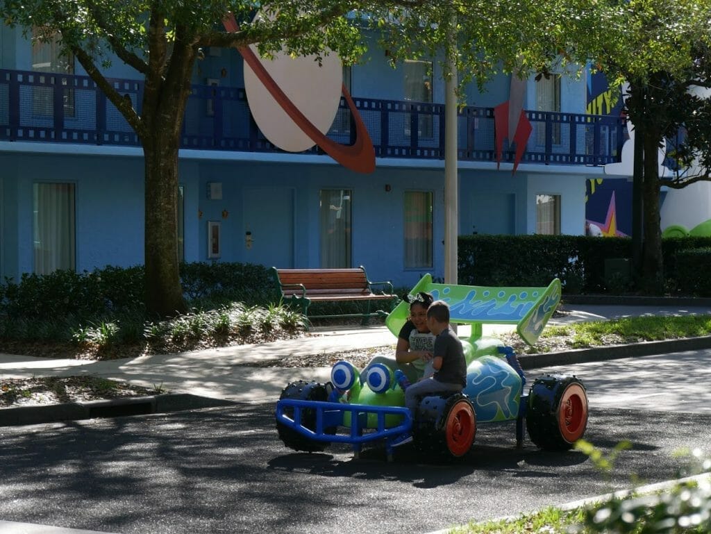 Disney All Star Movies resort Toy Story area with kids sitting on RC buggy