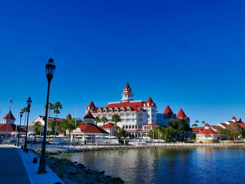 The Grand Floridian resort with water in front and blue sky