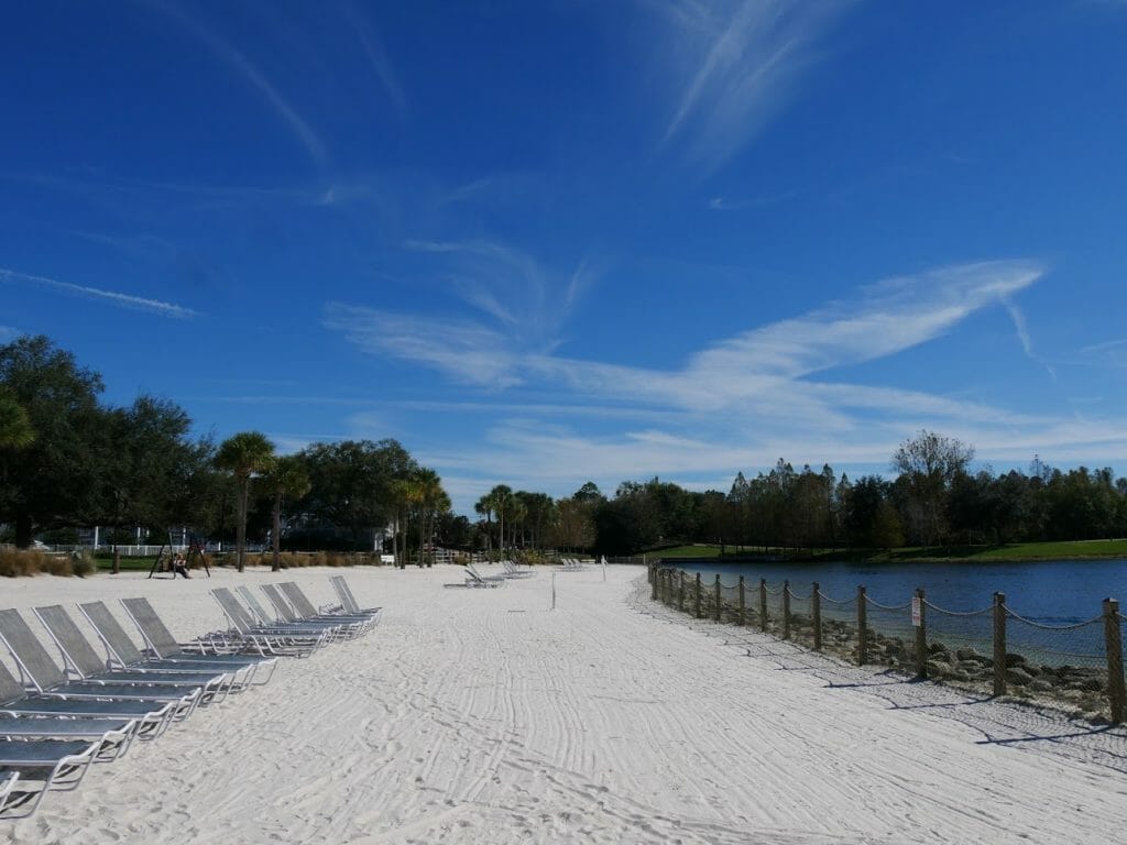 Deck chairs on a sandy beach at Beach Club resort