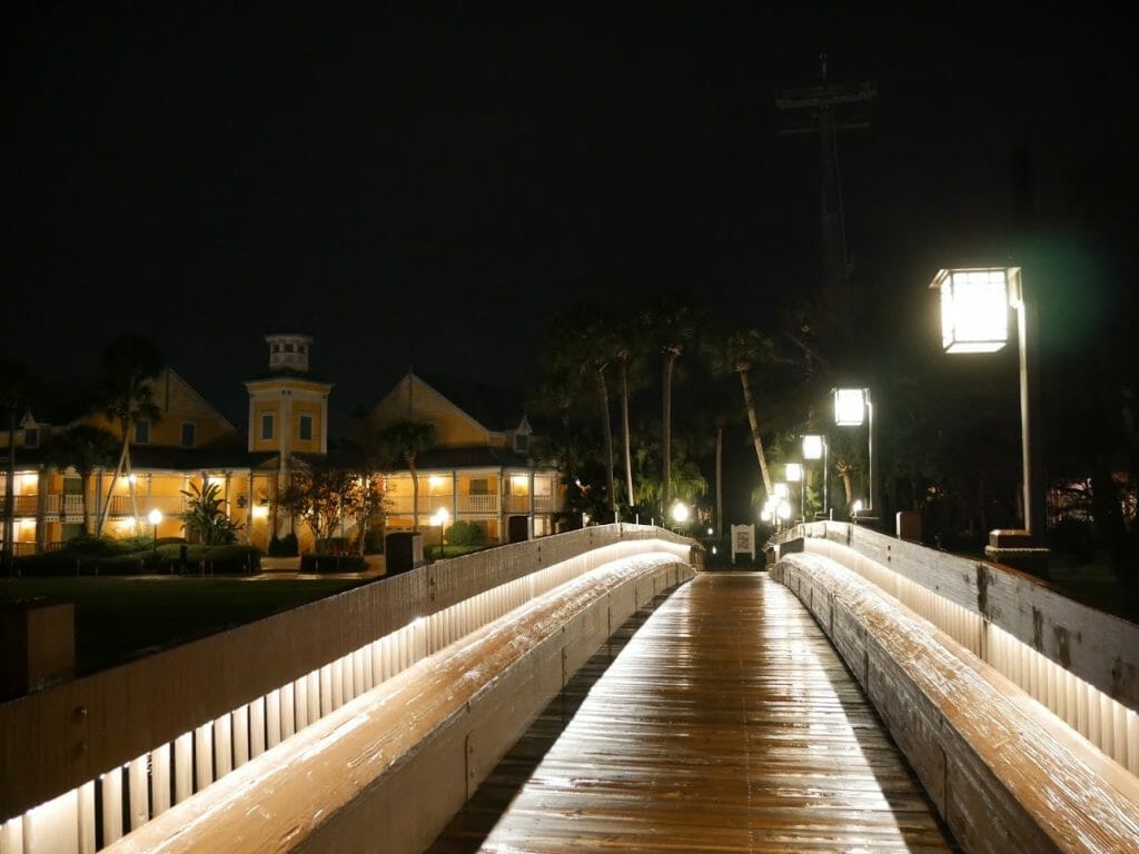 A bridge lit up at night at Disney's Caribbean Beach resort