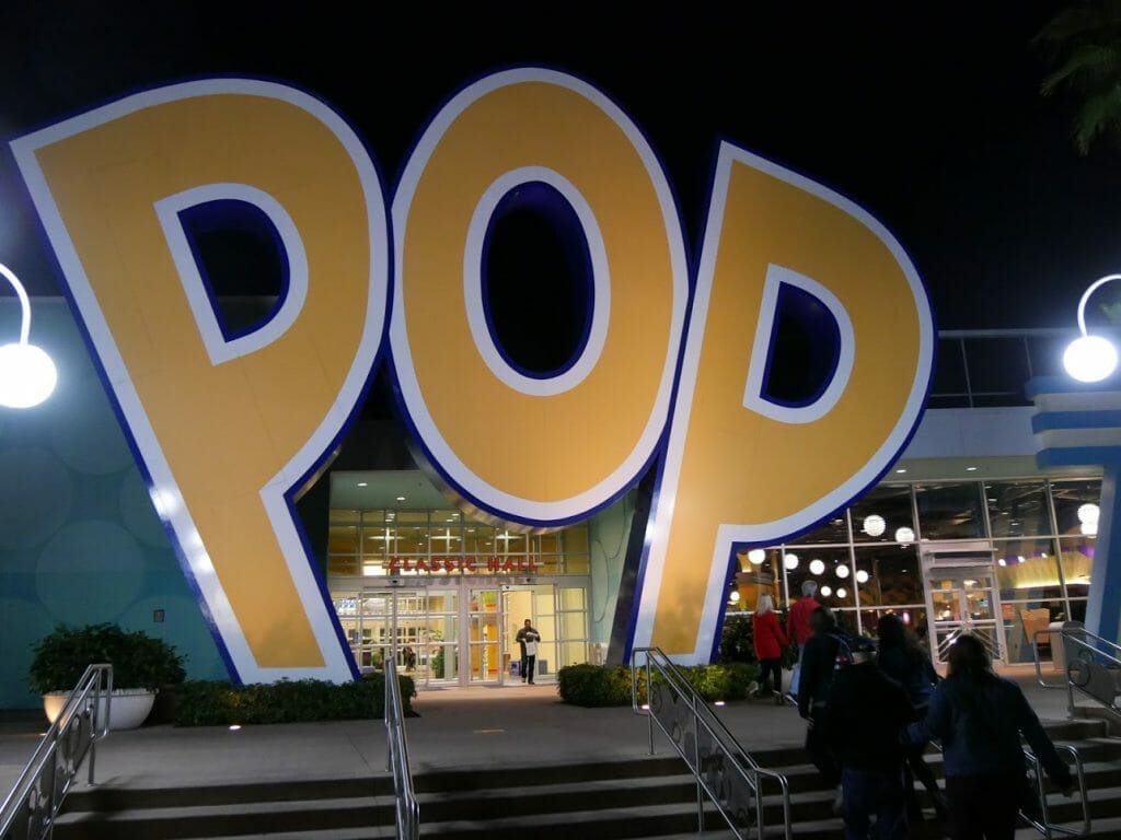 A big "pop" sign at Disney's Pop Century resort at night