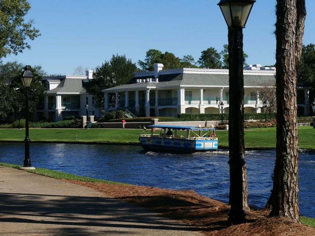 A Disney Springs boat on a river outside Port Orleans Riverside resort Disney