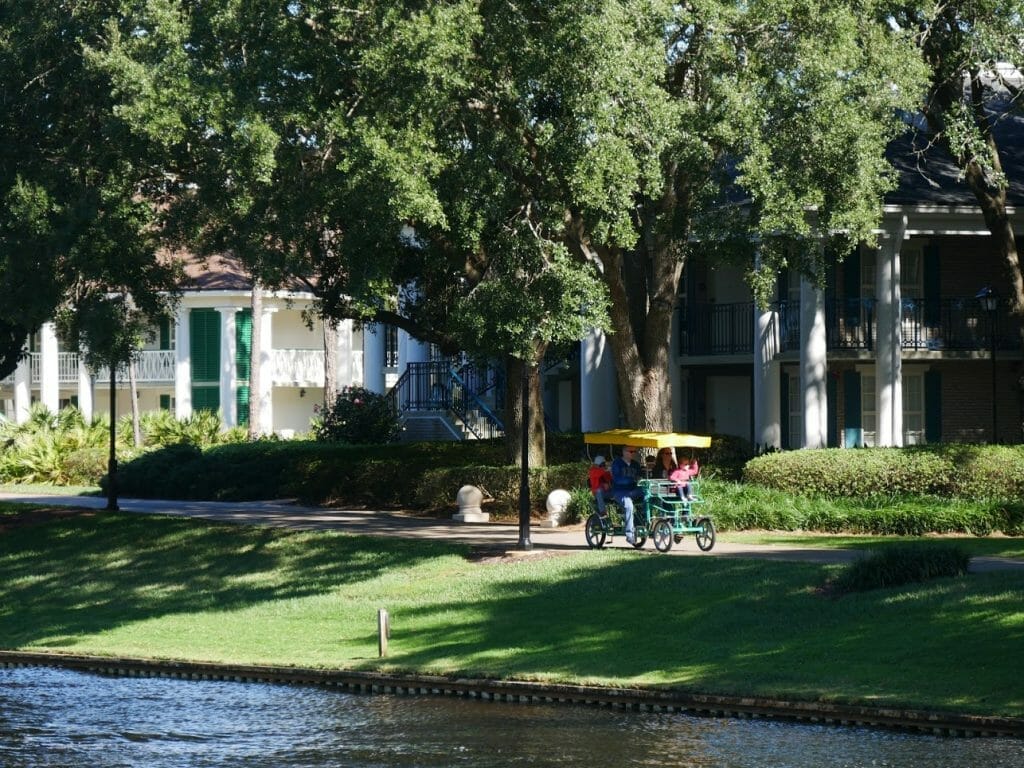 People in a 4 person bike at Port Orleans Riverside