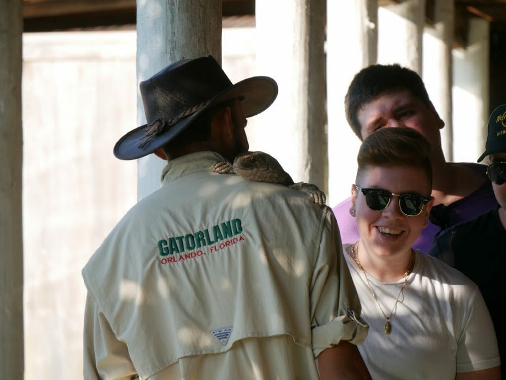 A staff member with an animal on his shoulder