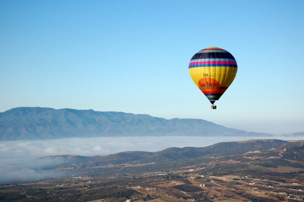 a hot air balloon floats over southern California