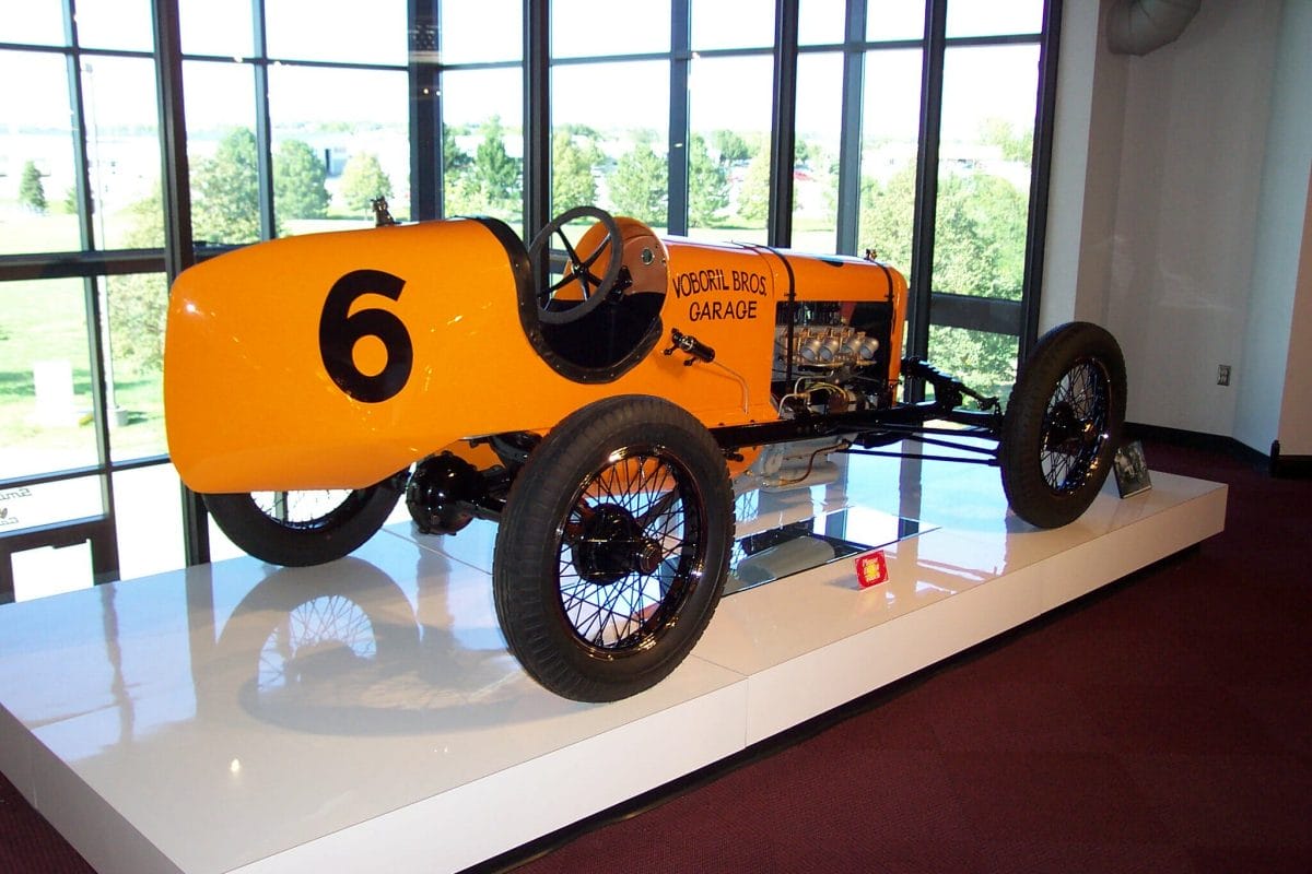 An orange, antique racing vehicle on display at the Museum of American Speed in Lincoln, NE.
