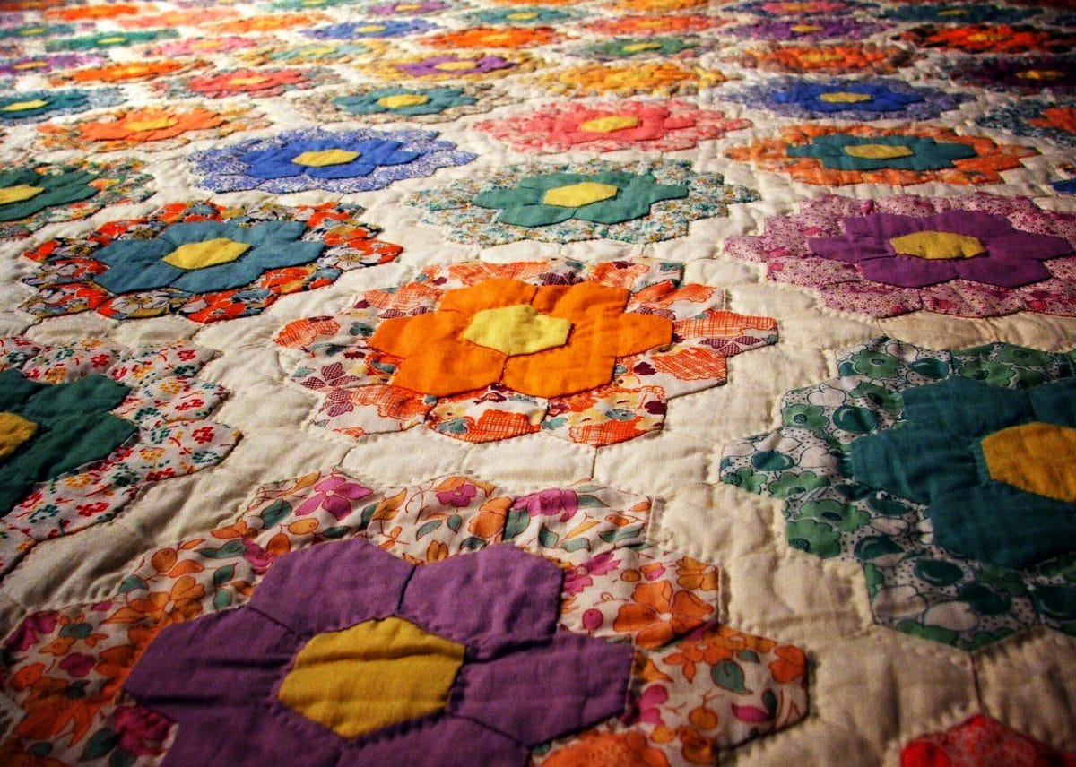 Close-up of a colorful quilt with a floral theme