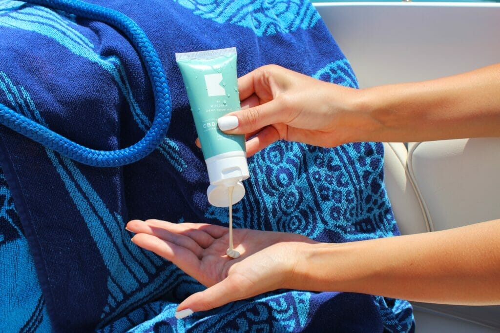 sunscreen and beach towel