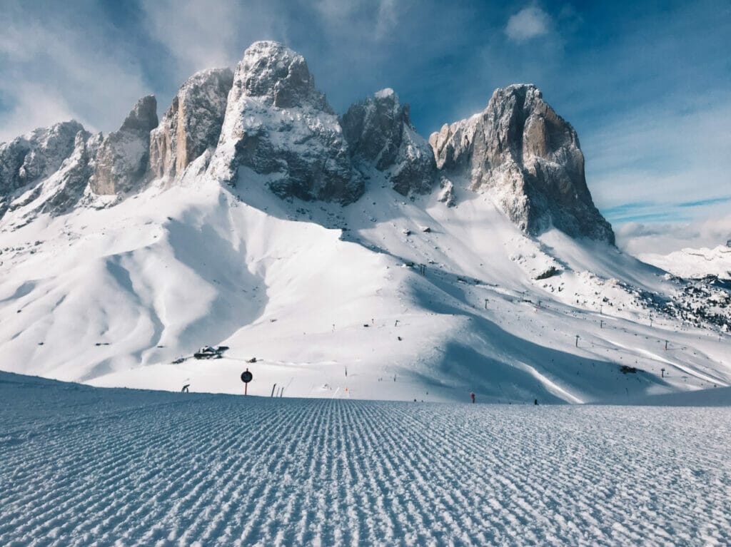 fresh ski run with mountains