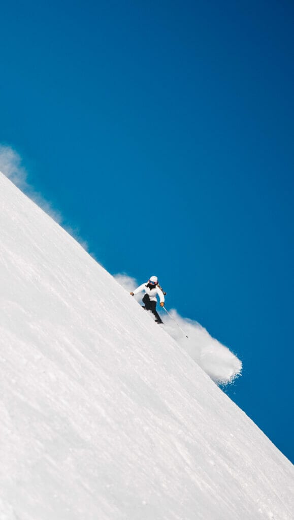 woman skiing on a steep slope