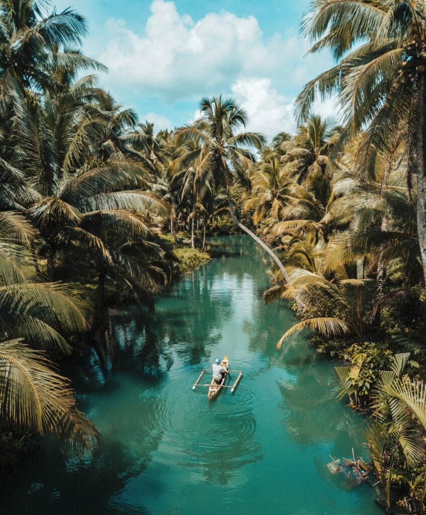 man on a canoe in the jungle