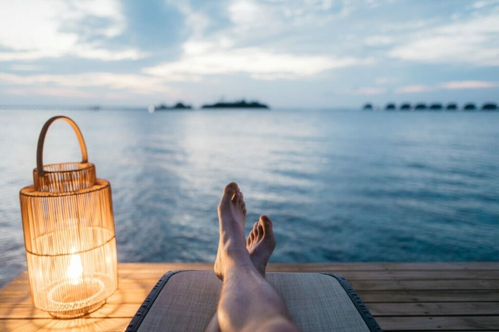 feet with water behind