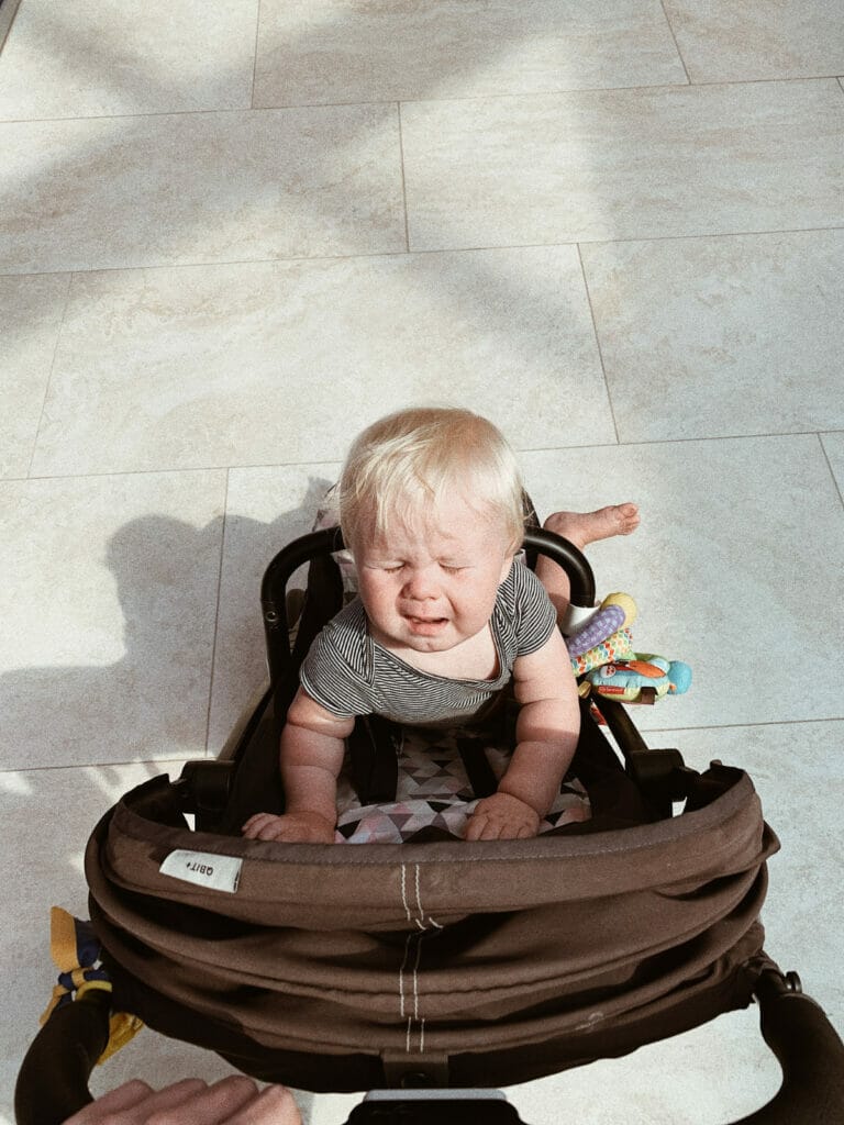 child crying in stroller