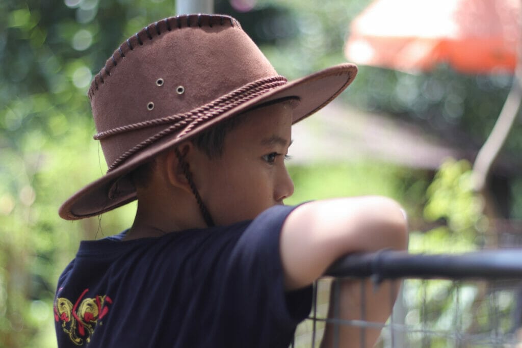 boy wearing safari hat