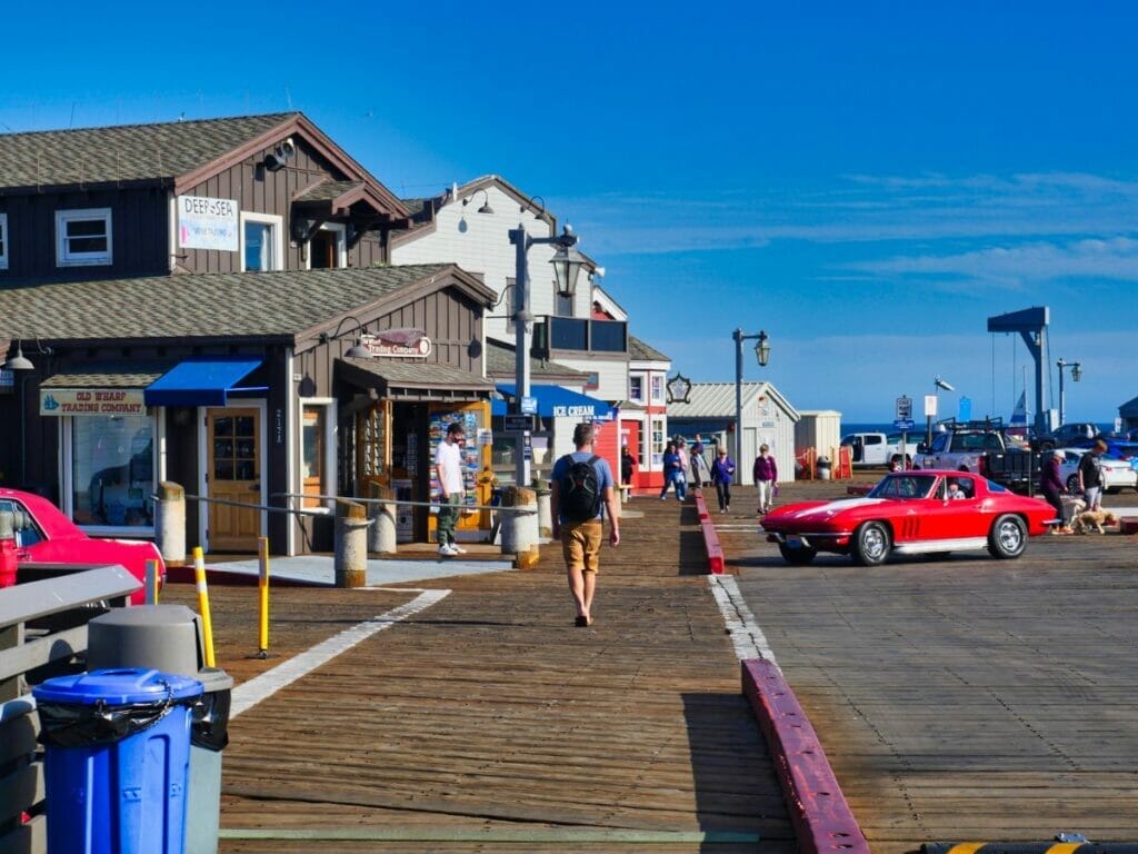 man walking down the santa barbara pier