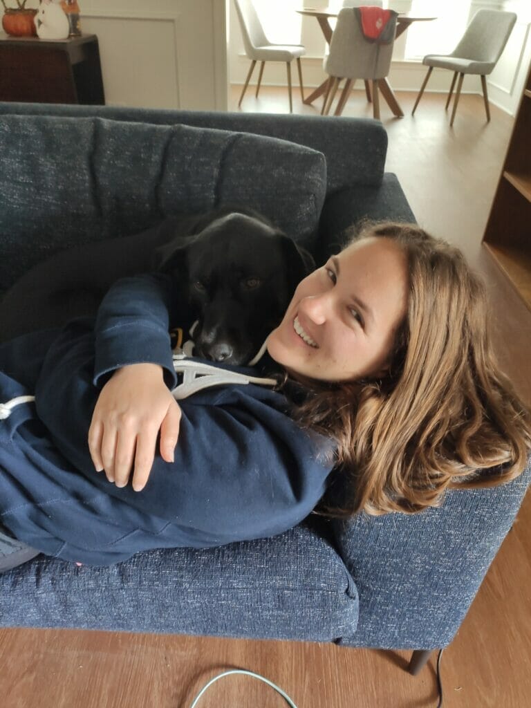 girl holding a dog