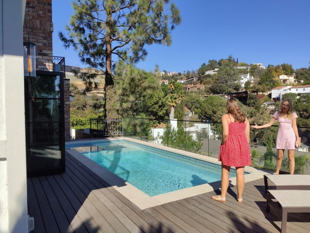 women looking at swimming pool