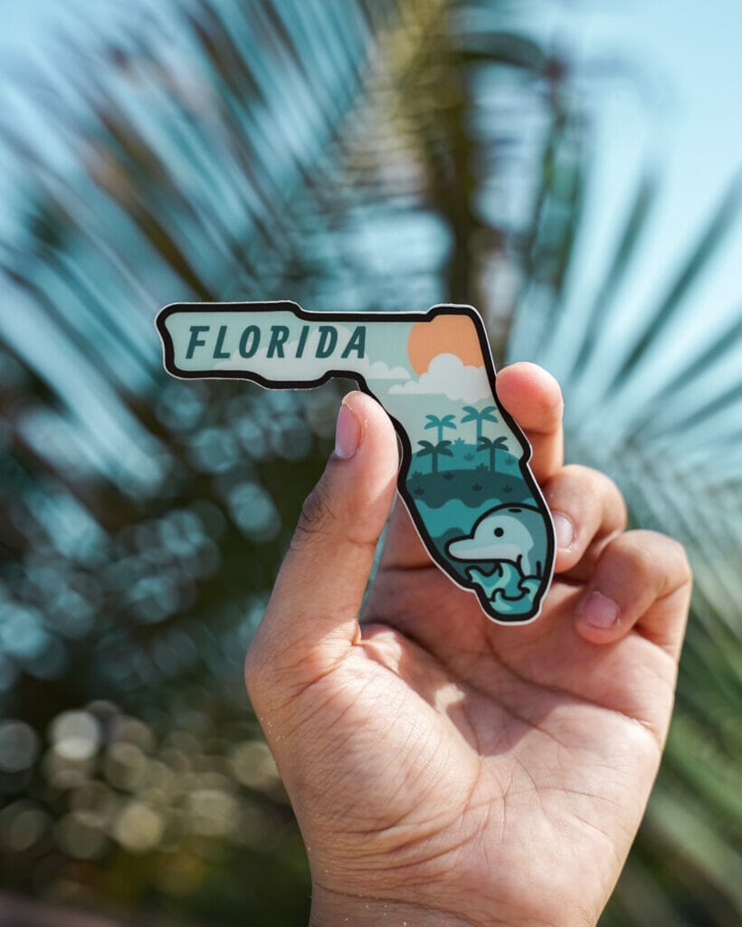 hand carrying Florida magnet