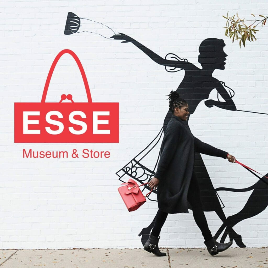 Woman smiling outside the ESSE Purse Museum & Store 