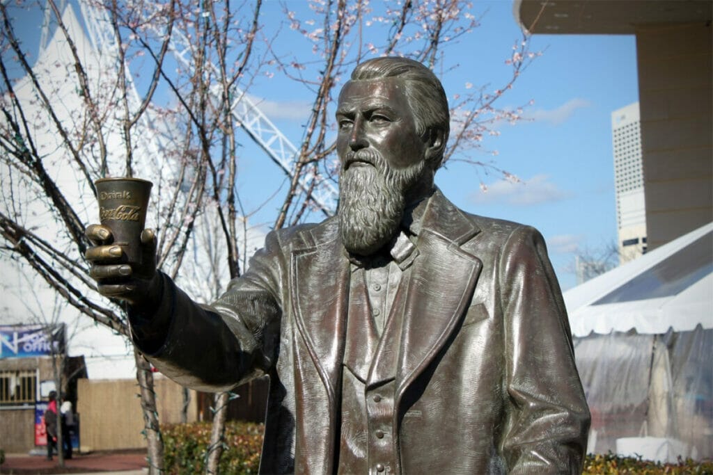 Statue of John S. Pemberton holding a Coke 