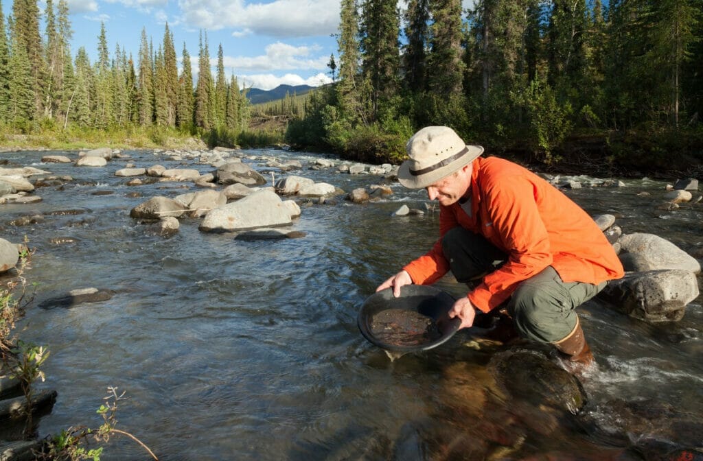 Man panning for gold in Alaska