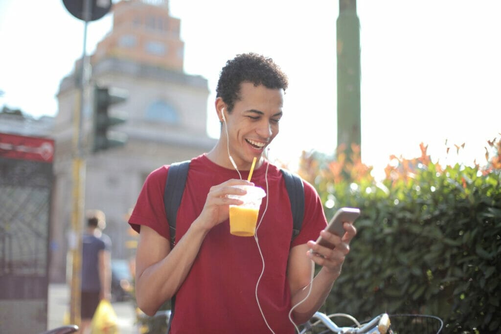 Man laughing at something on his phone